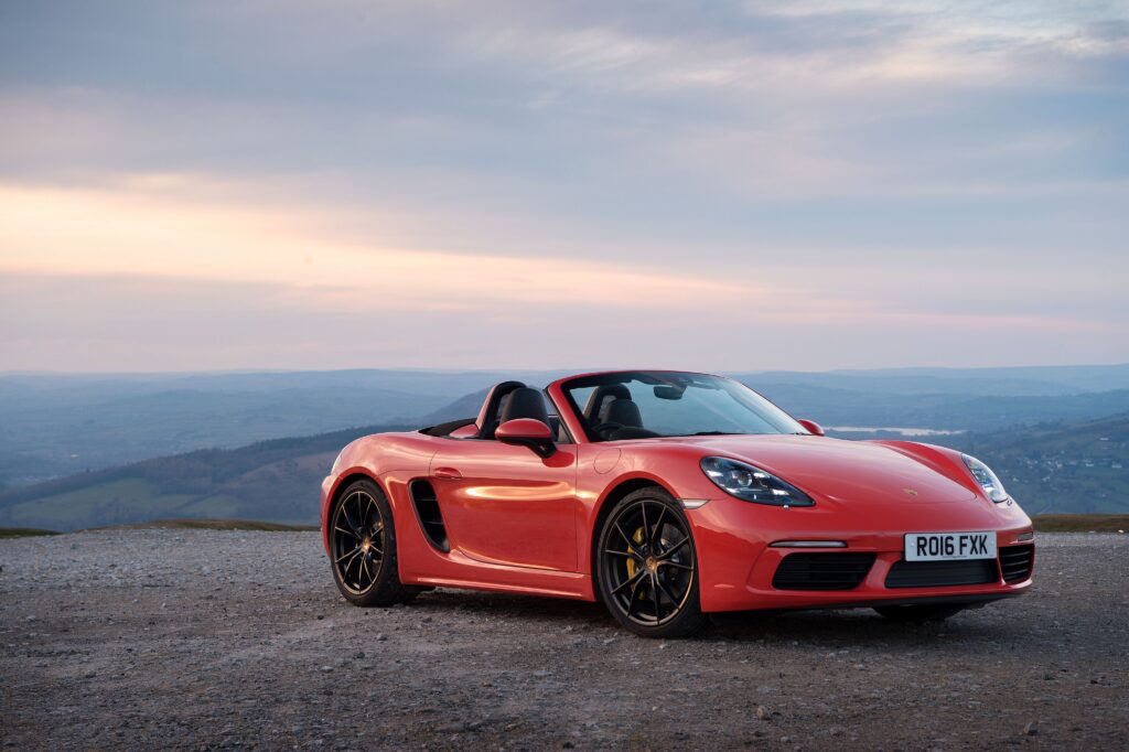 Red Car Convertible Porsche Boxster on the backgrounds of the