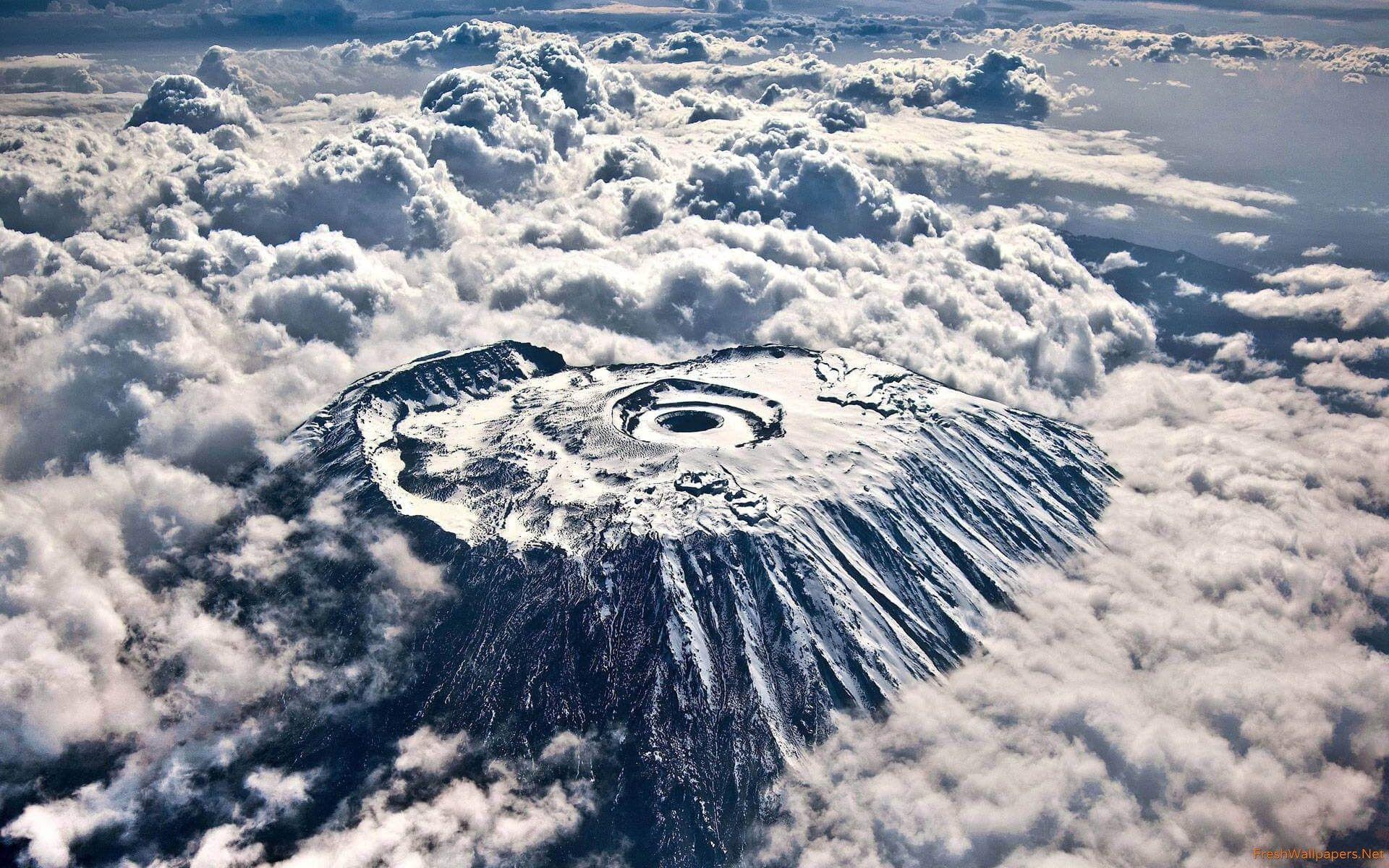 Mount Kilimanjaro Crater Over Clouds From The Air wallpapers