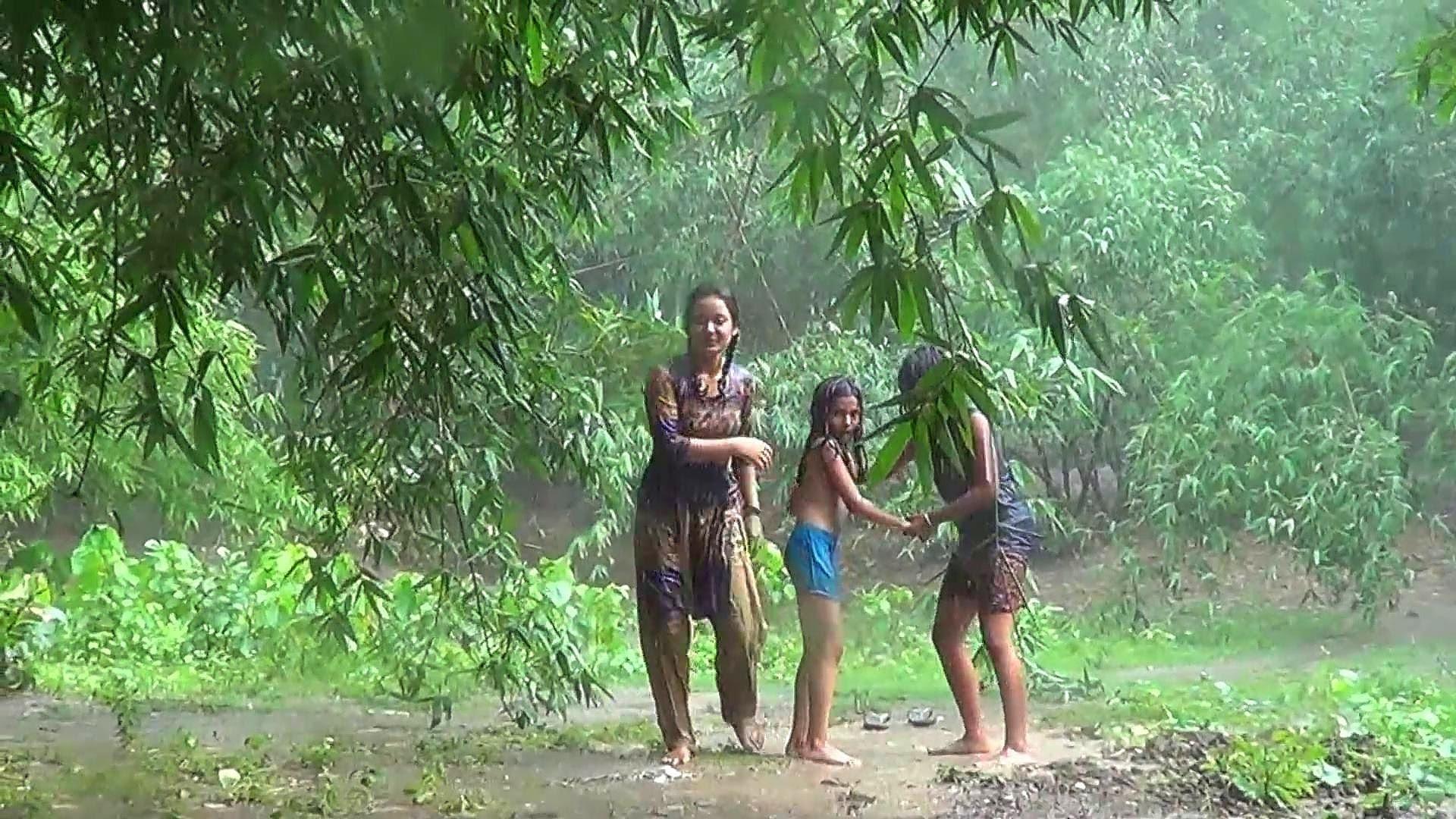 Villege girl bath rain Bangladesh