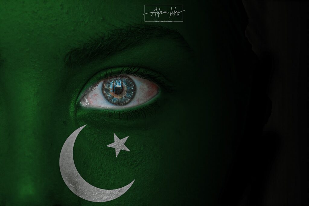 Photo of the flag of Pakistan on the face of a Child backgrounds