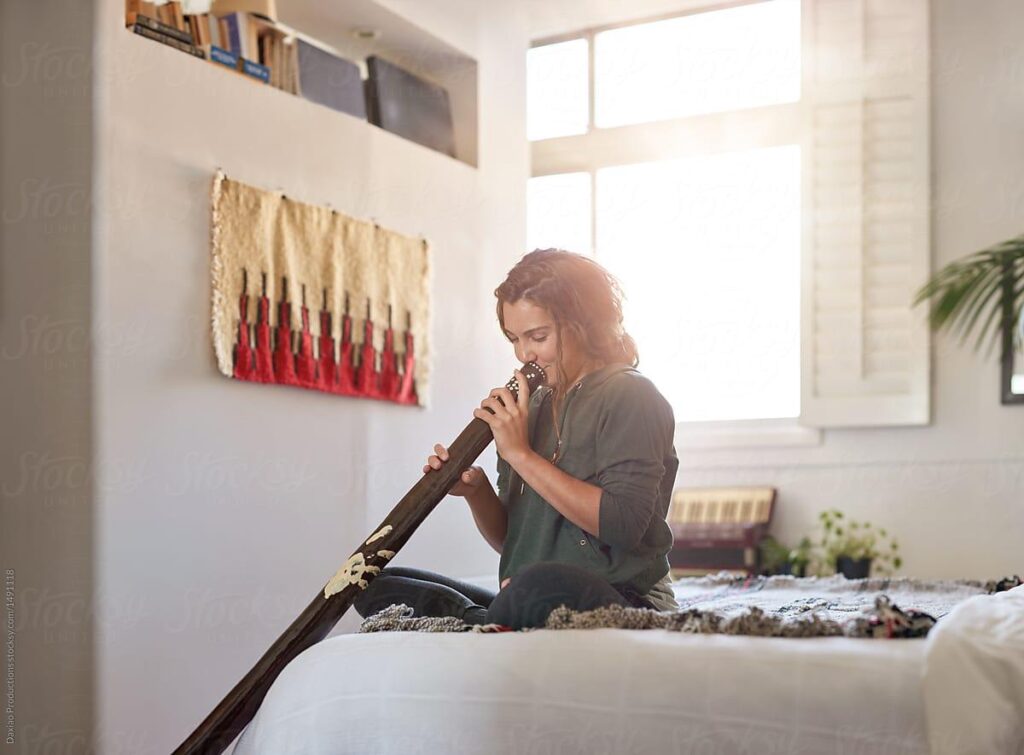 Alternative Unusual Musical Instrument Didgeridoo Player At Home