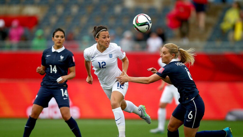 Lucy Bronze of England is challanged by Amandine Henry of France