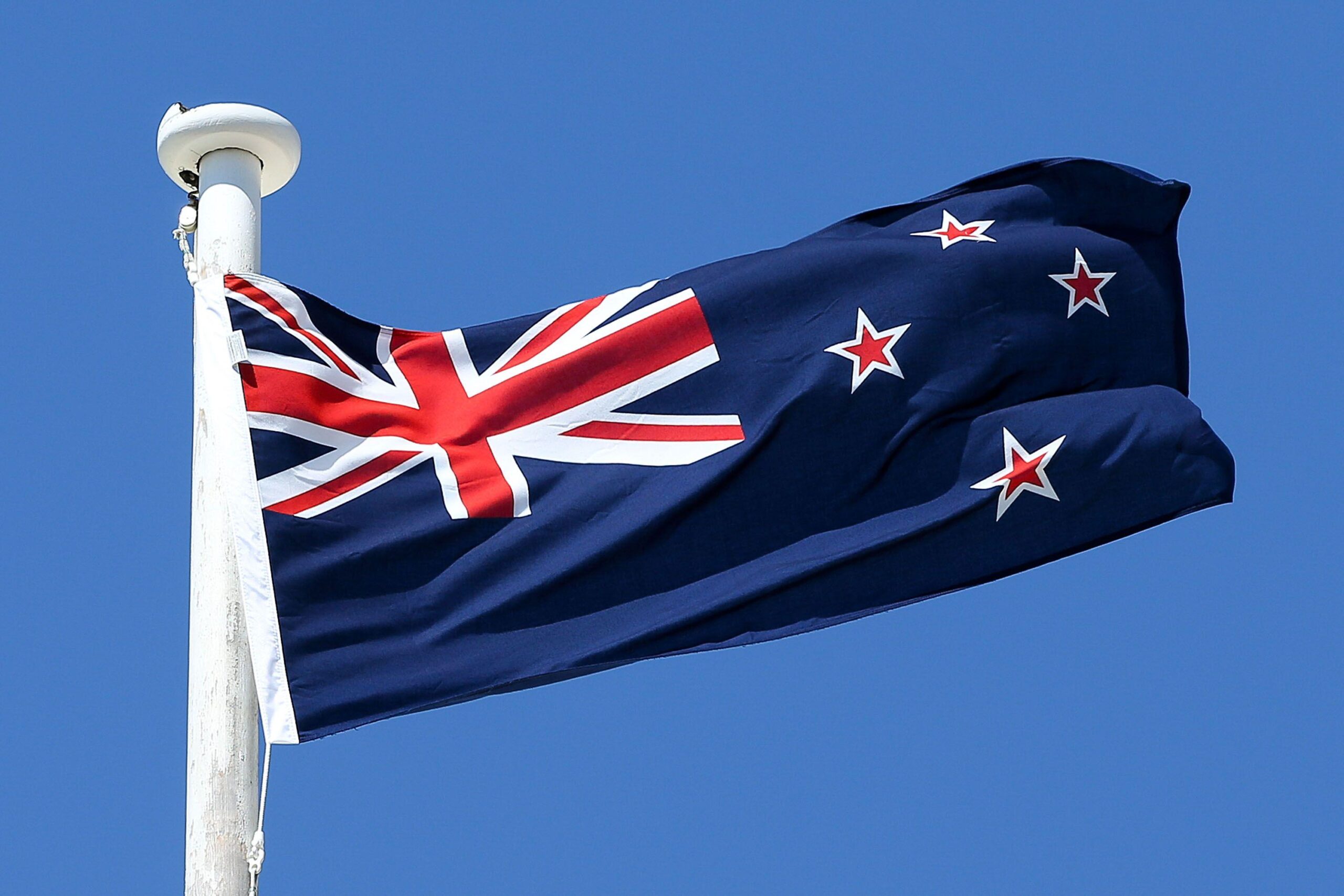 Newzealand National Flag Waving In Wind 2K Wallpapers Download