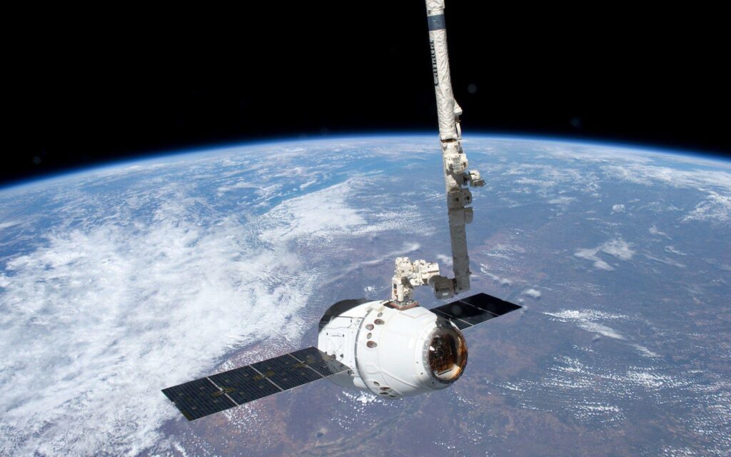 Robotic Arm Grapples SpaceX Dragon at International Space Station