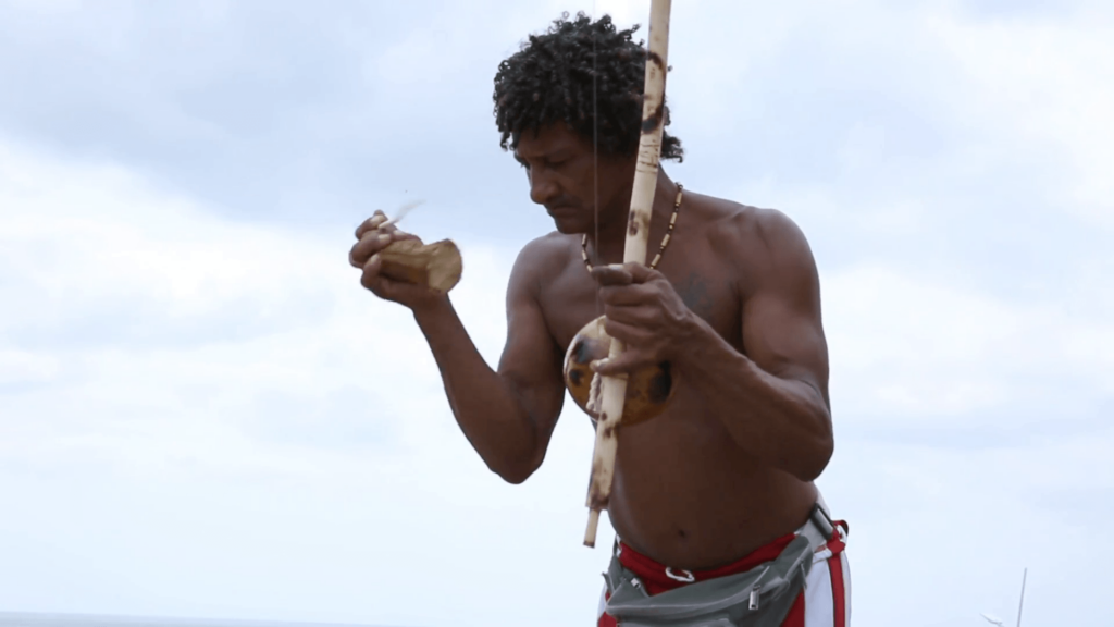 Brazilian playing Berimbau Instrument in Salvador, Bahia, Brazil