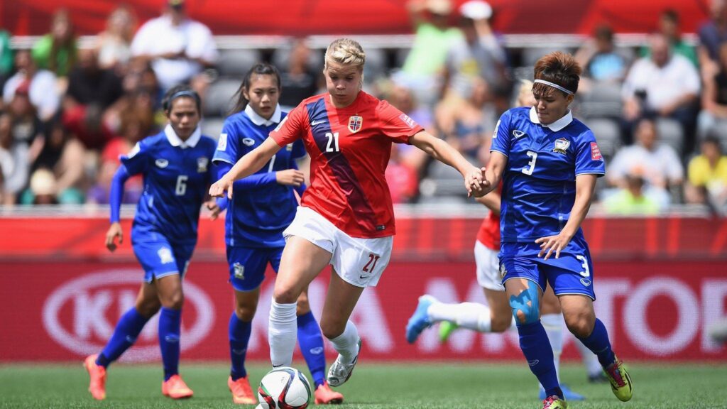 Ada Hegerberg of Norway is challenged by Natthakarn Chinwong of