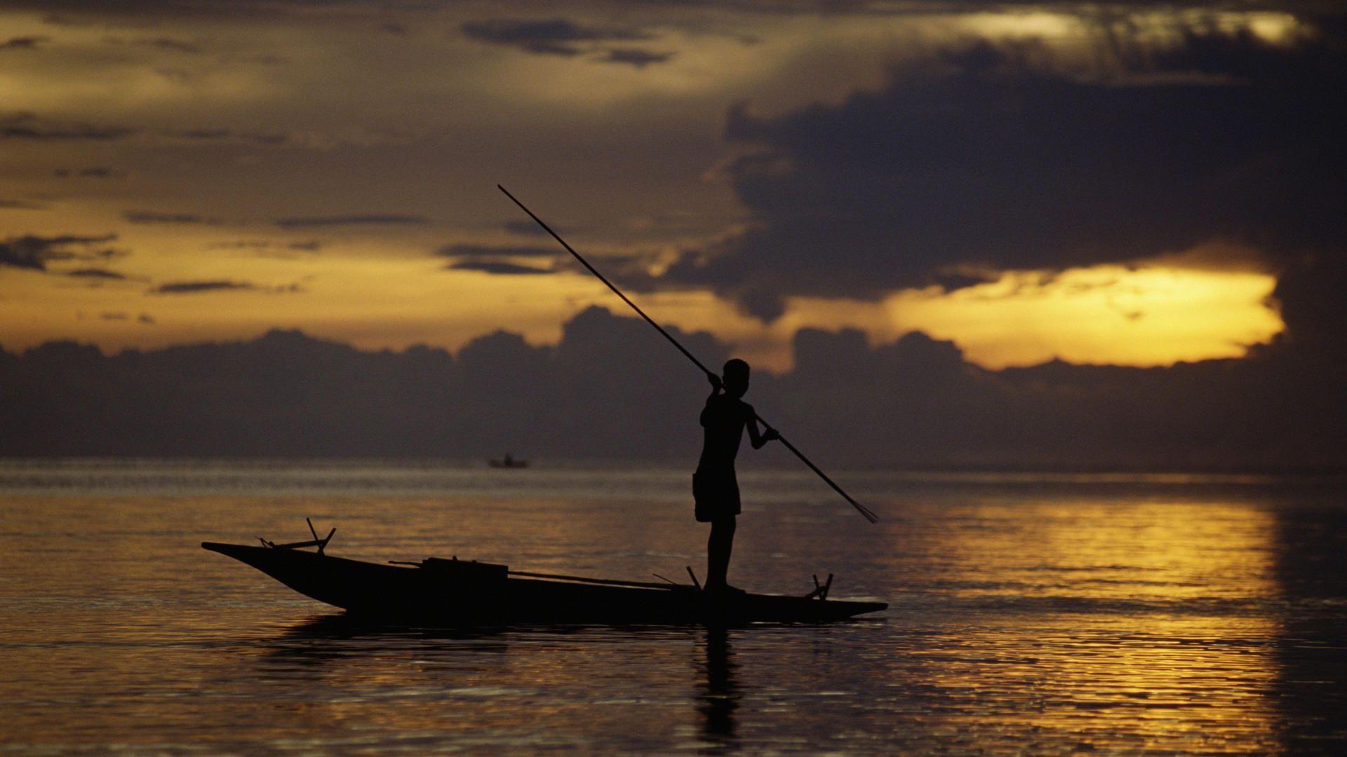 Nature Fisherman At Sunset, Fergusson’s Island, Papua New Guinea