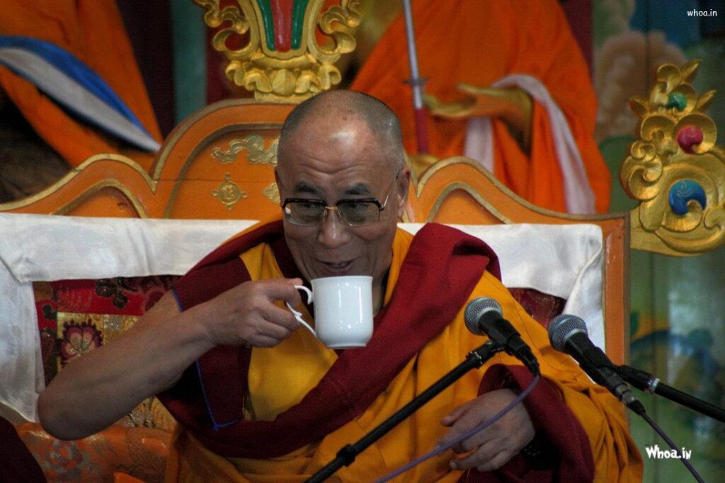 Dalai Lama With Cup Of Tea 2K Wallpapers