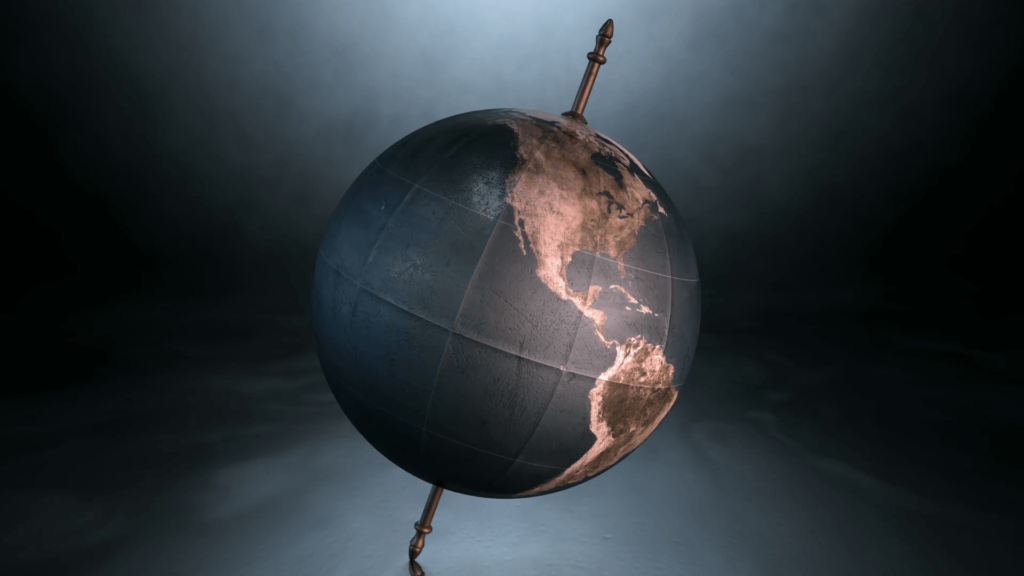 A static view of a world globe ornament spinning on a tilted axis on