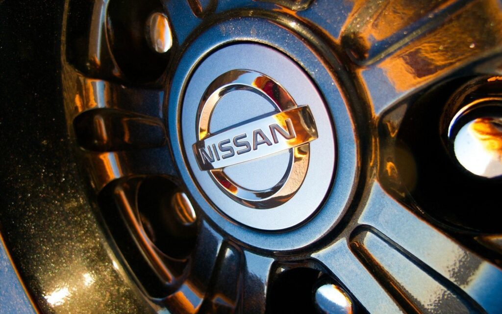 Nissan Logo on Wheel 2K Wallpapers Download Wallpapers from