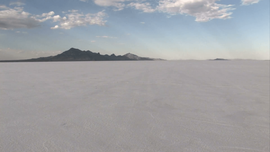 Speeding on Bonneville Salt Flats away Utah M 2K Stock Video Footage