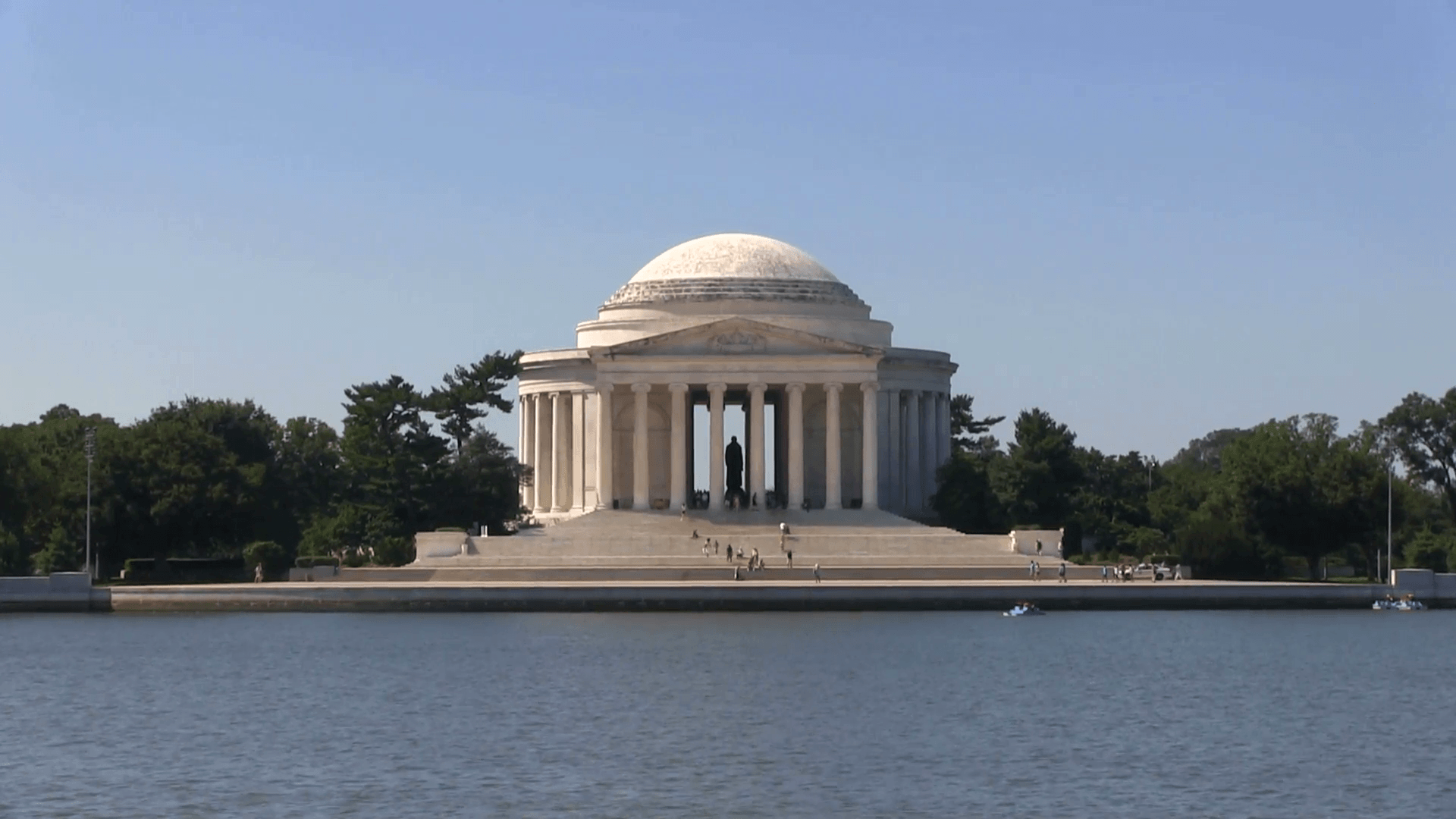 Tourists climb the steps of the Thomas Jefferson Memorial shot from