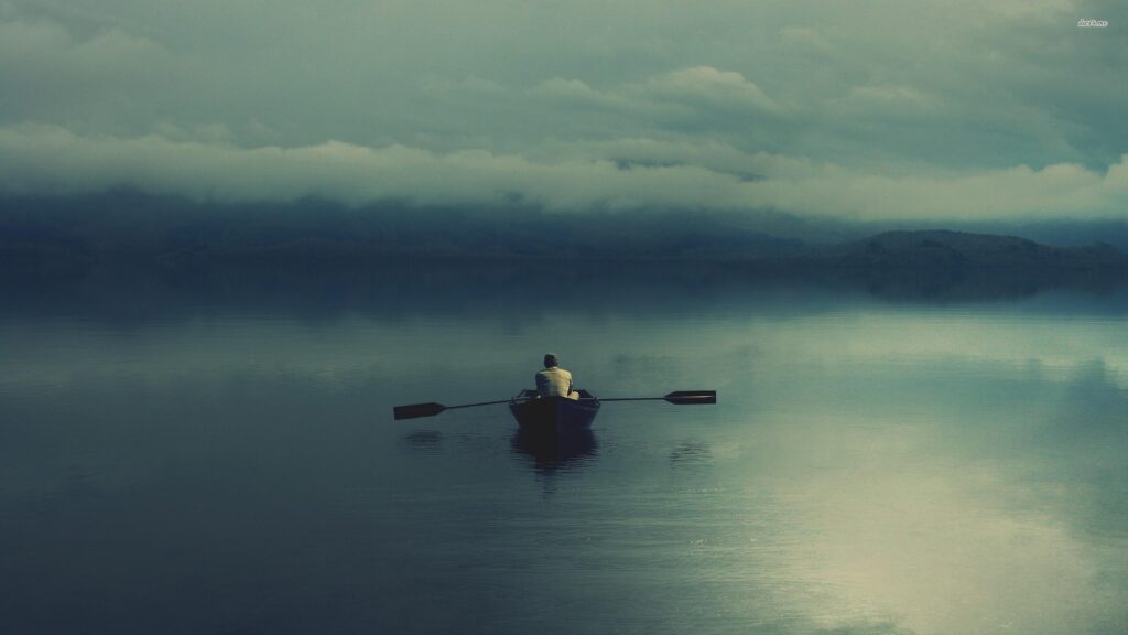 Man rowing on the dark lake wallpapers