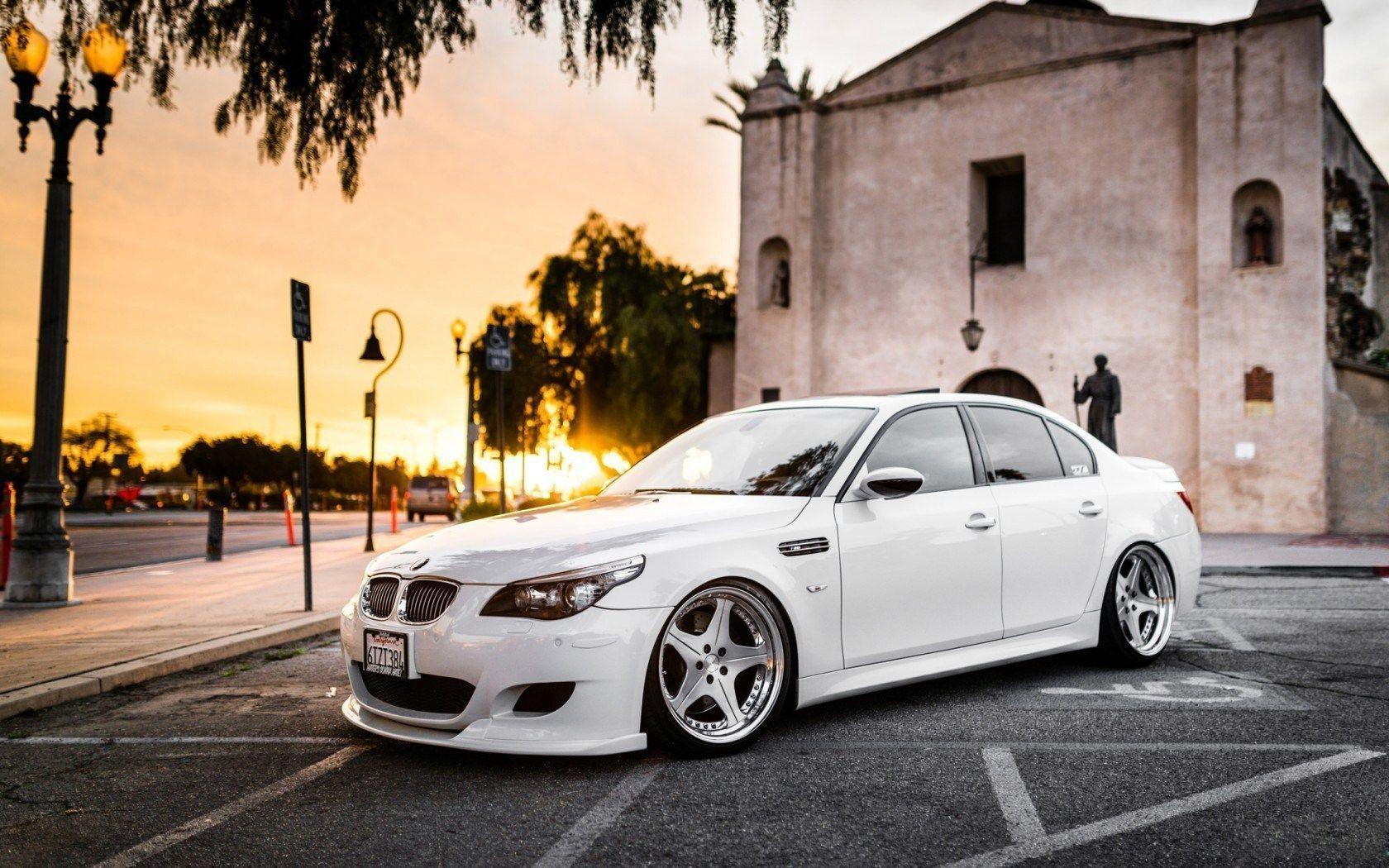 White BMW M Parked Outside Church City 2K Wallpapers